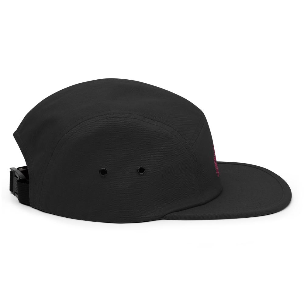 a black hat sitting on top of a skateboard 