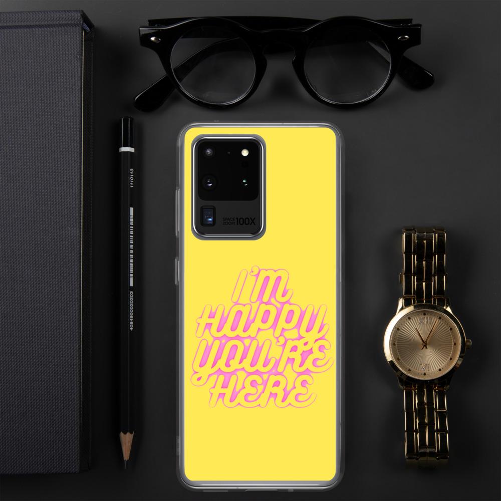 a yellow cell phone sitting on top of a table 